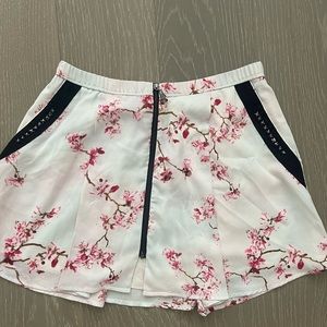 Pensey mini skirt with cherry blossoms and studs. Size XS